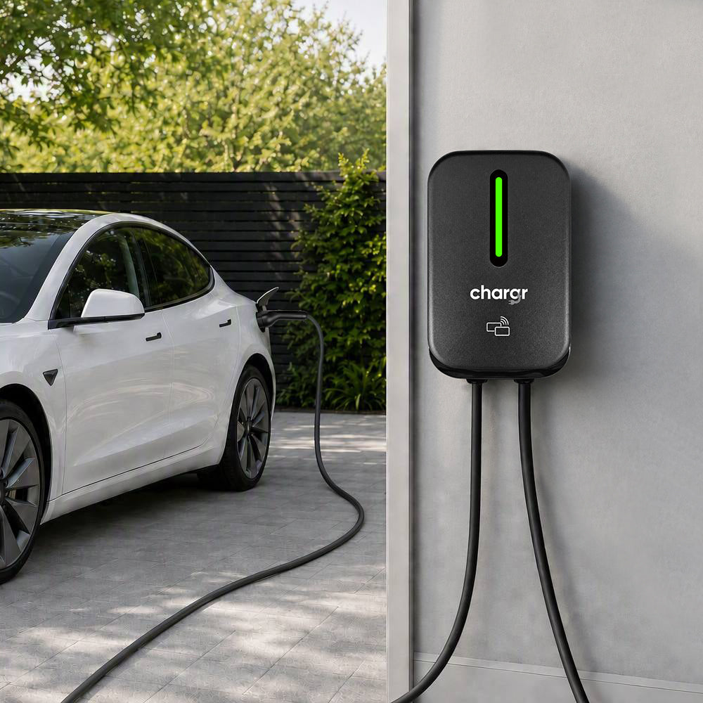 Chargr WP18 wallbox charging a white Tesla in the driveway